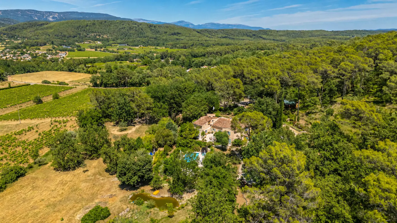 Bateau Perdu bastide at golden hour with a long table set in the olive grove